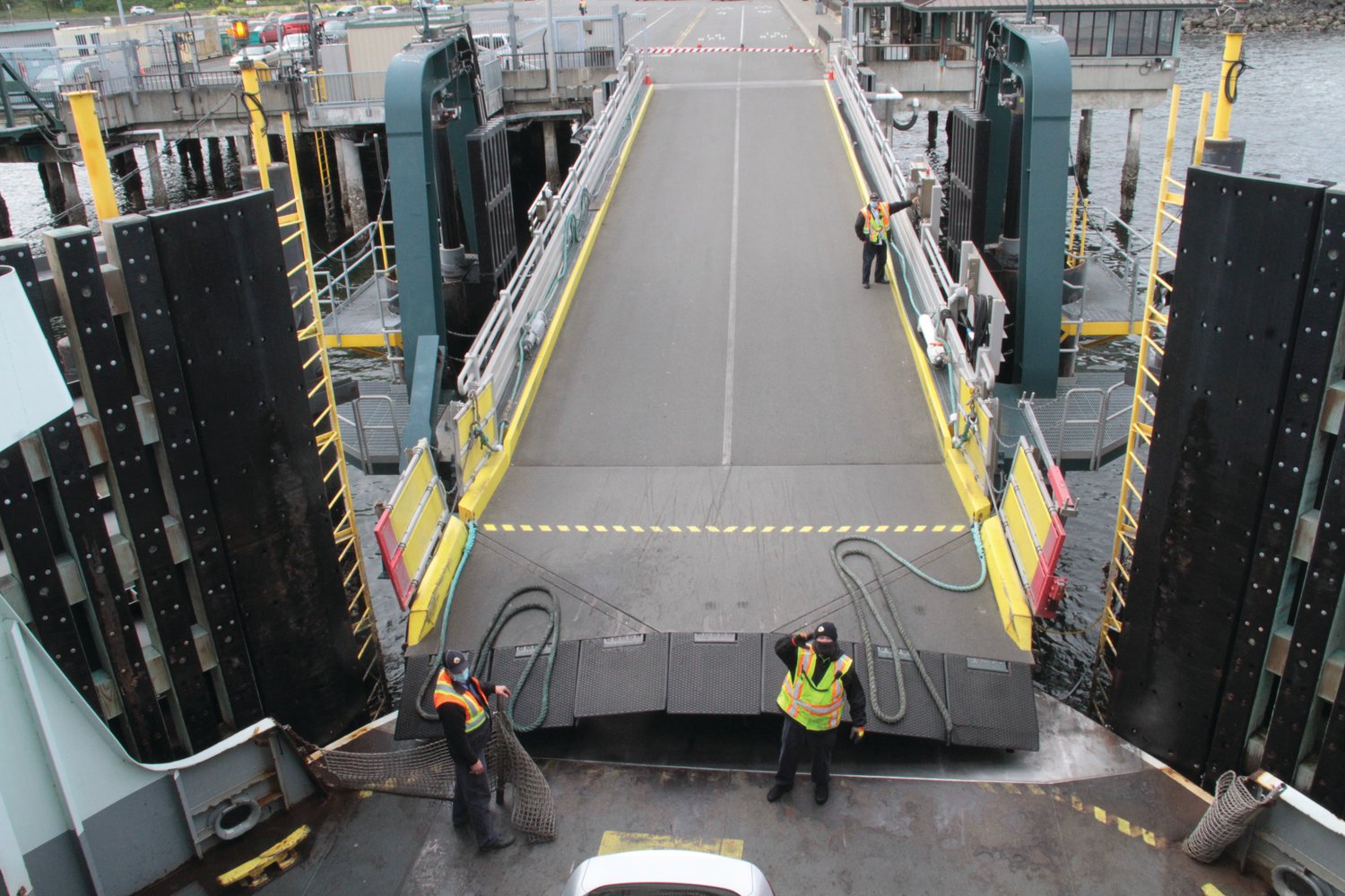 WSF workers lower the ramp at the Port Townsend Ferry Terminal after the arrival of the ferry M/V Kennewick.